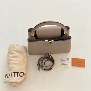 LOUIS VUITTON
Taurillon Capucines PM Galet